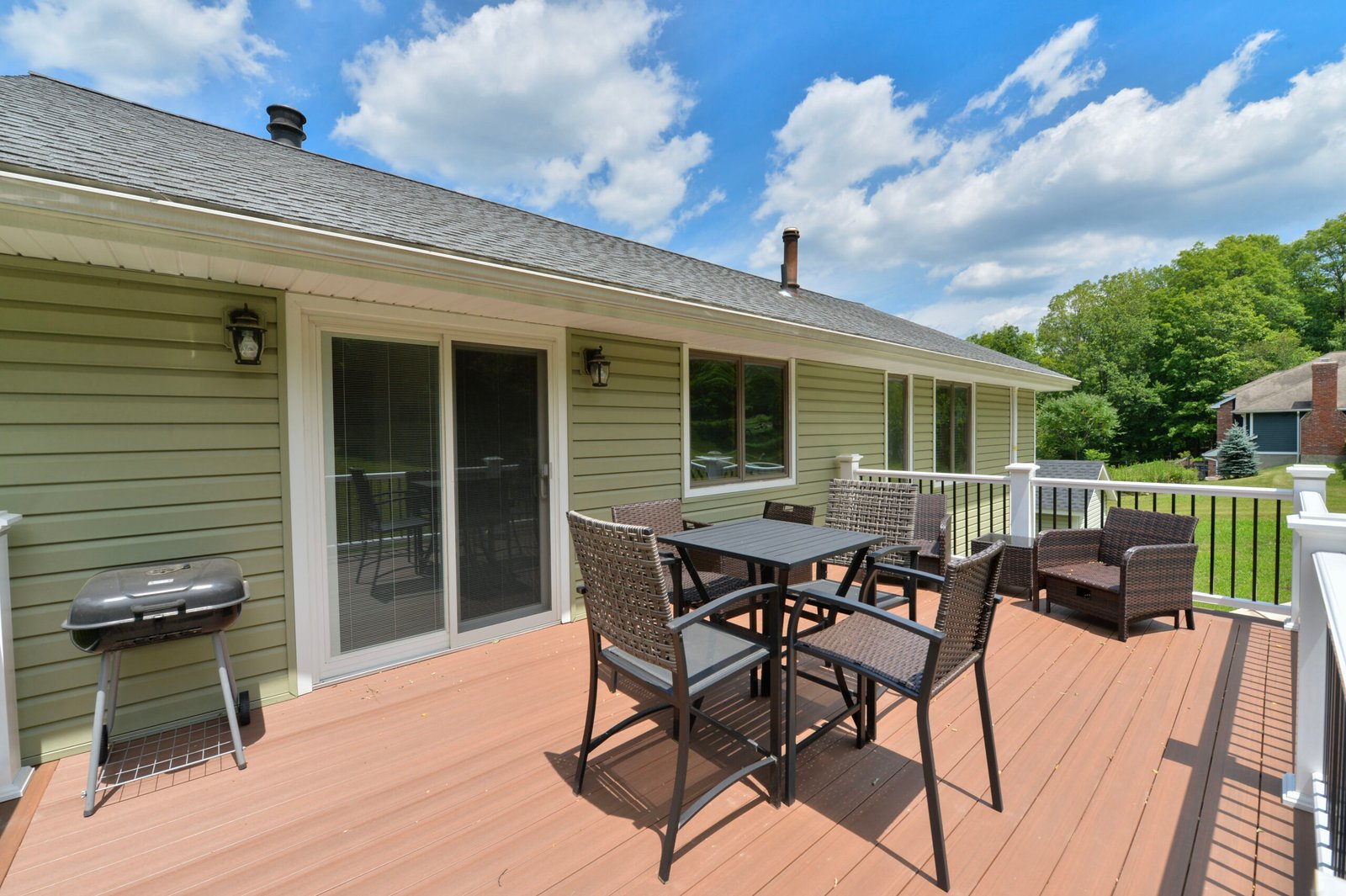 Top Story of Two Story Deck with Table and Chairs