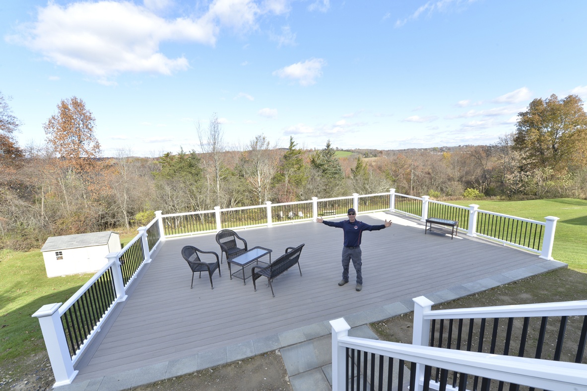 Chris Kehoe standing on newly remodeled deck