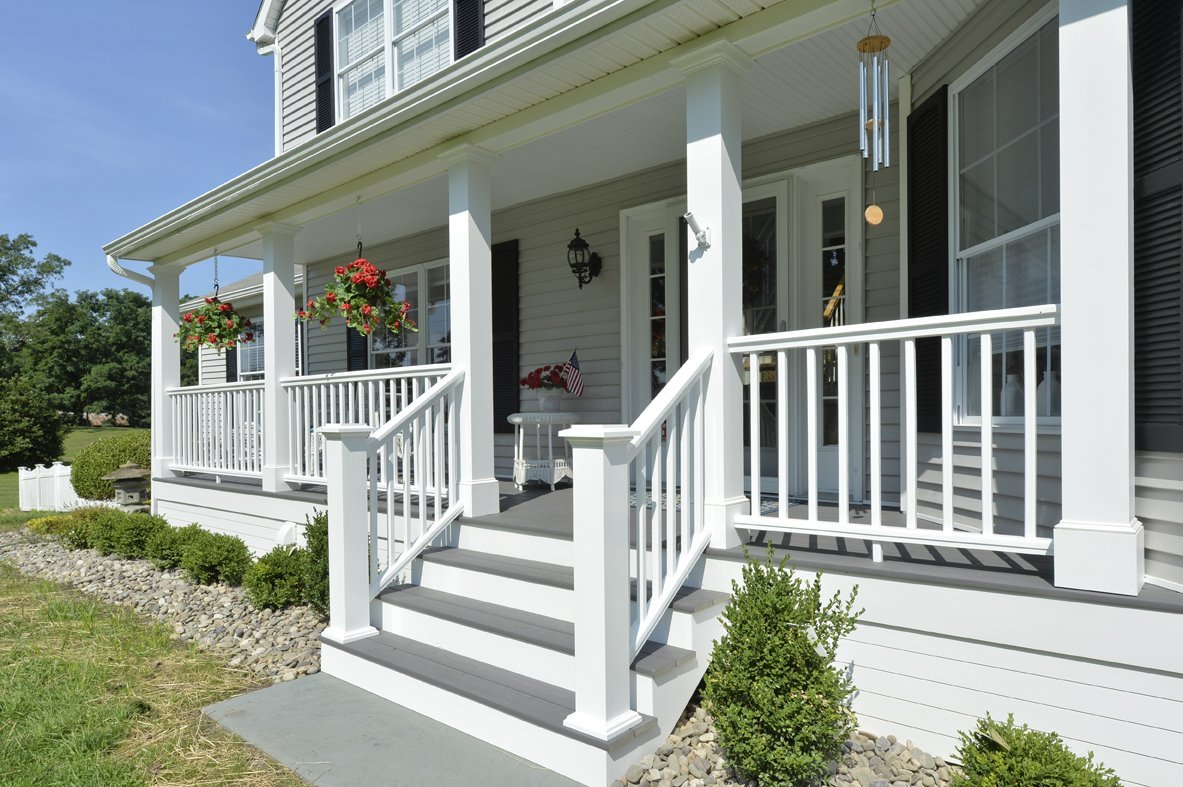 beautiful front porch with fall themed decorations