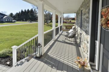 front porch with stone facade and timbertek porch